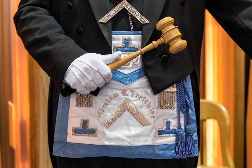 Closeup of man wearing a Masonic Apron